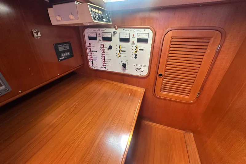 Slide: The Image of Control panel of a 1986 Mason 33 yacht with wooden interior. - 38