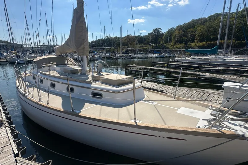 Slide: The Image of Sailboat docked at marina, Mason 33 model, 1986, under clear blue sky. - 4