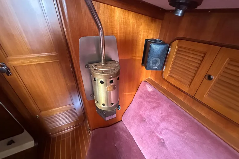 Slide: The Image of Vintage Mason 33 yacht interior with wood paneling and heater, 1986 model. - 41