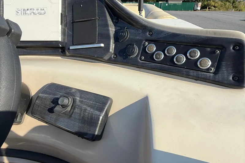 Slide: The Image of 2019 Bentley Pontoons 223 Cruise dashboard with control panel and Simrad display. - 10