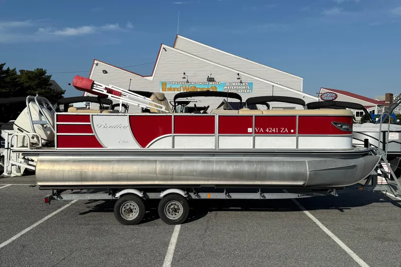 Slide: The Image of 2019 Bentley Pontoons 223 Cruise on trailer, parked at a marina. - 14