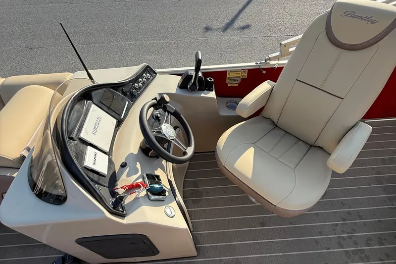 Slide: The Image of 2019 Bentley Pontoons 223 Cruise helm with steering wheel and captain's chair. - 8