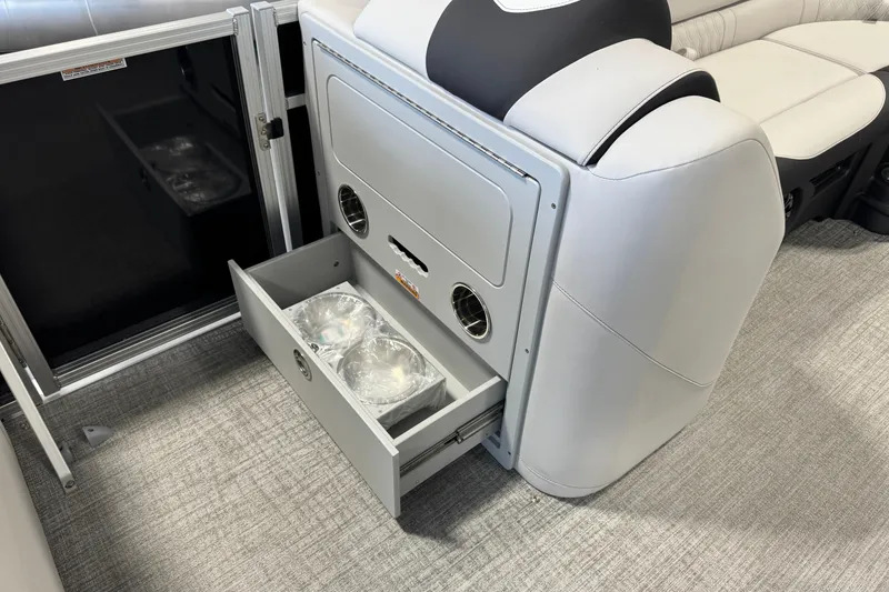 Slide: The Image of 2026 Avalon LSZ ELW boat interior with open storage drawer and seating. - 10