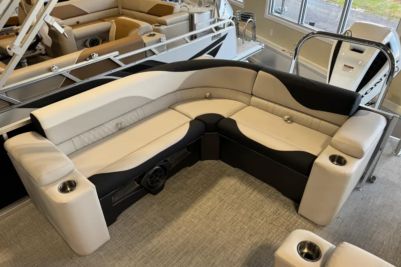 Slide: The Image of Luxurious seating on 2026 Avalon LSZ ELW pontoon boat with cup holders and modern design. - 12