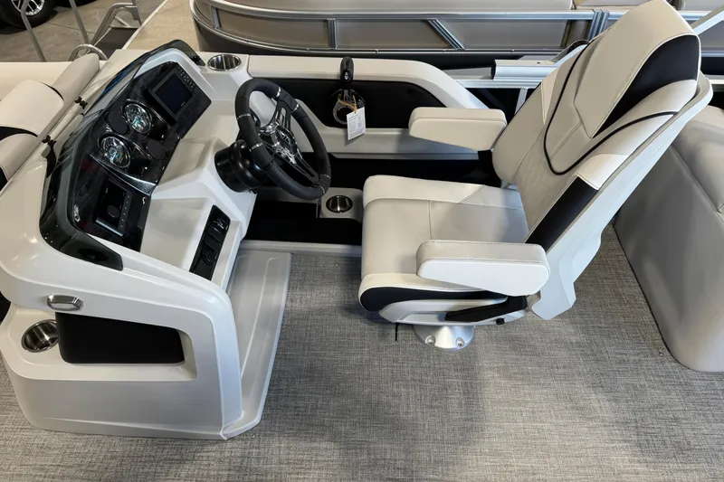 Slide: The Image of 2026 Avalon LSZ ELW boat cockpit with modern steering and comfortable captain's chair. - 7