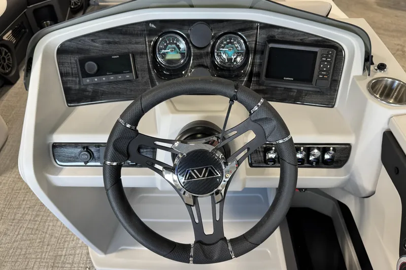 Slide: The Image of Steering console of 2026 Avalon LSZ ELW boat with modern controls and gauges. - 8