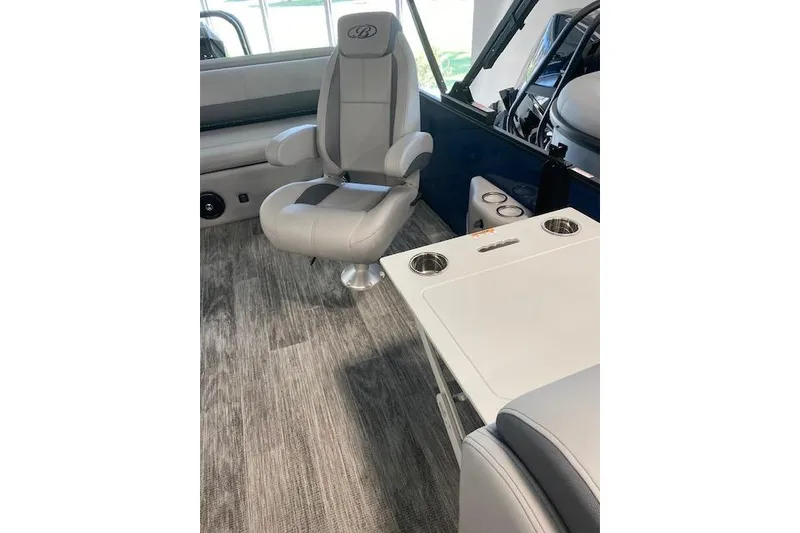 Slide: The Image of 2026 Bentley Pontoons Legacy 243 Swingback interior with plush seating and modern design. - 4
