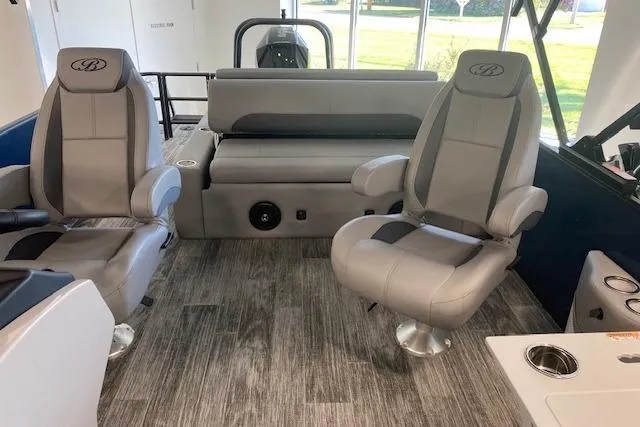 Slide: The Image of 2026 Bentley Pontoons Legacy 243 Swingback interior with seating and railing, showcasing modern design. - 5
