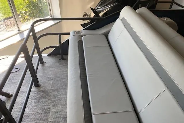 Slide: The Image of 2026 Bentley Pontoons Legacy 243 Swingback interior with seating and railing. - 9