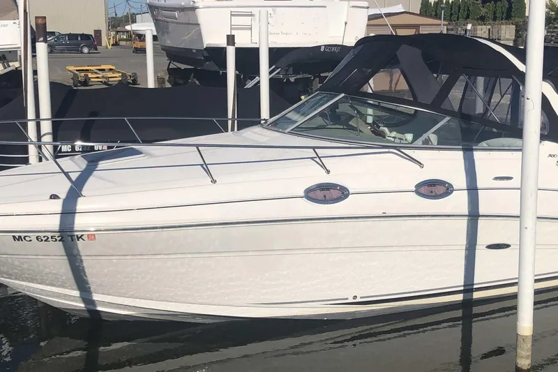 The Image of 2005 Sea Ray 280 Sundancer boat docked at marina, side view. - 0