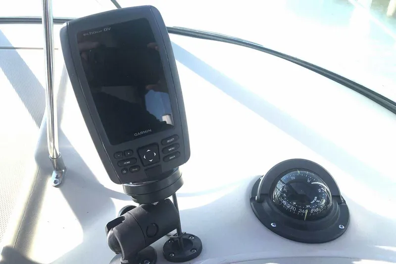 Slide: The Image of Garmin echomap DV and compass on 2005 Sea Ray 280 Sundancer boat dashboard. - 11