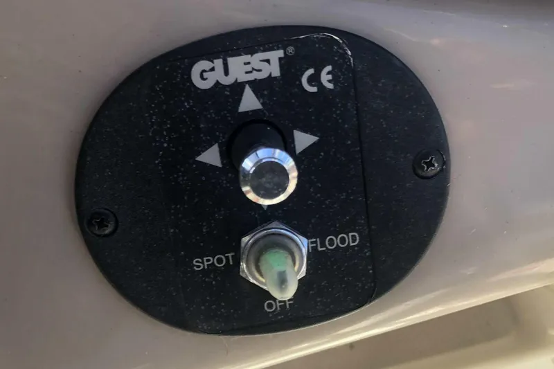 Slide: The Image of Control panel for spotlight and floodlight on 2005 Sea Ray 280 Sundancer boat. - 12