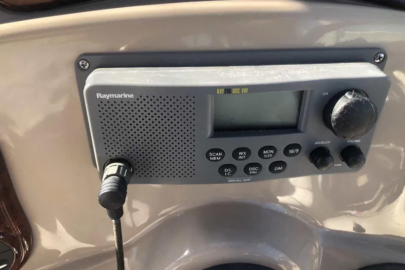Slide: The Image of Raymarine VHF radio on 2005 Sea Ray 280 Sundancer boat dashboard. - 13