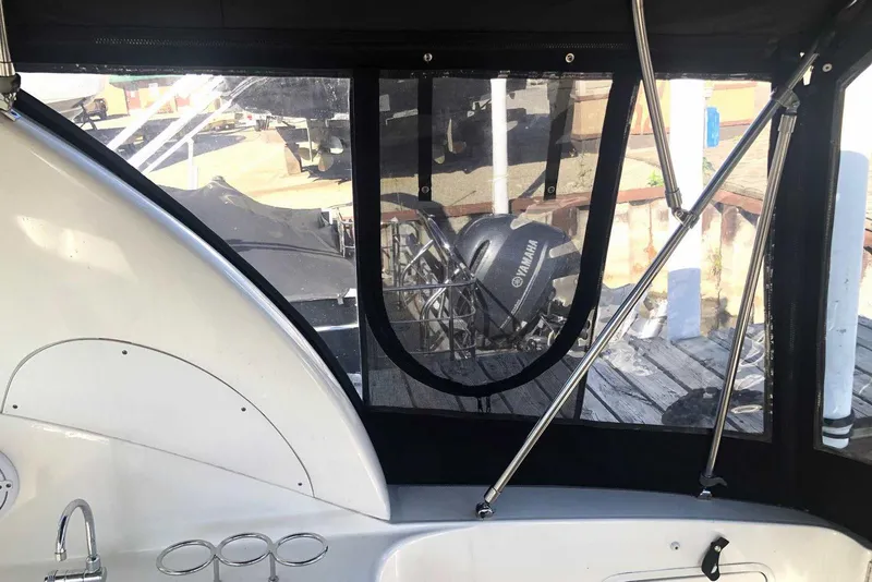 Slide: The Image of 2005 Sea Ray 280 Sundancer interior with window view of Yamaha engine. - 19