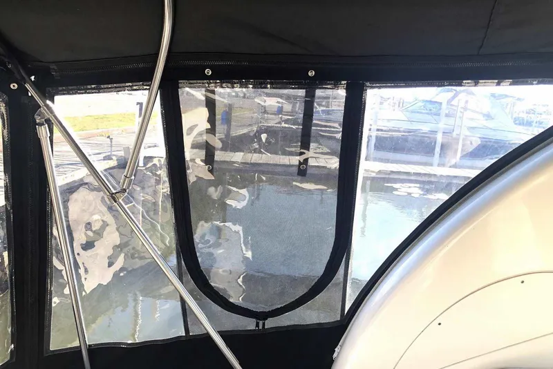 Slide: The Image of Interior view of 2005 Sea Ray 280 Sundancer boat with clear window panels. - 24