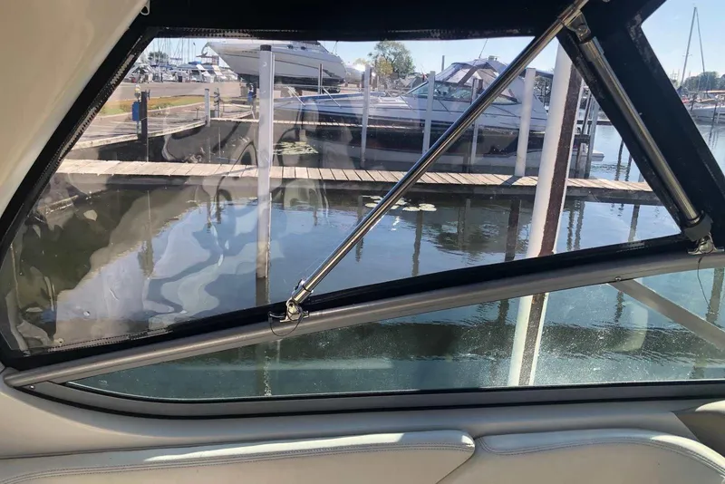 Slide: The Image of View from inside a 2005 Sea Ray 280 Sundancer, overlooking marina and docked boats. - 27