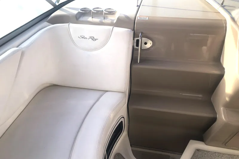 Slide: The Image of 2005 Sea Ray 280 Sundancer interior with white seating and steps. - 28