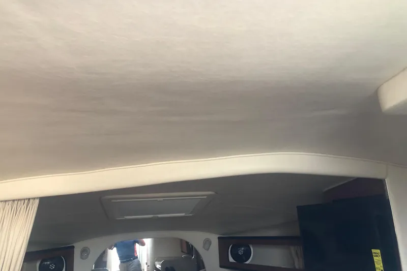 Slide: The Image of Interior view of 2005 Sea Ray 280 Sundancer cabin with ceiling and partial furnishings. - 32