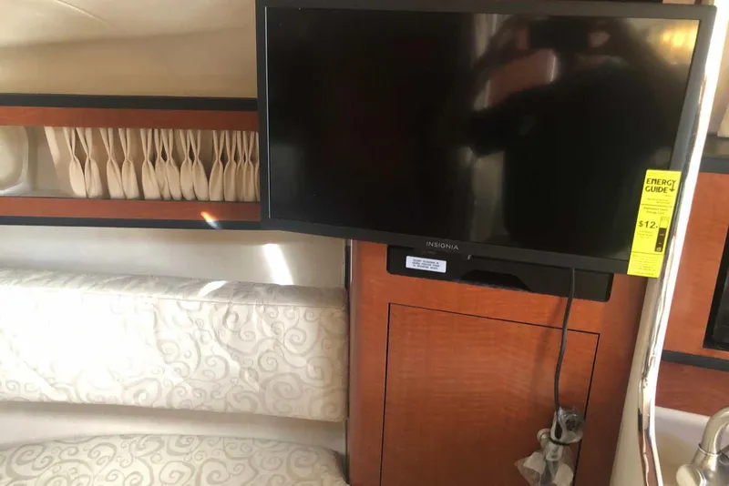 Slide: The Image of 2005 Sea Ray 280 Sundancer interior with TV and seating area. - 35