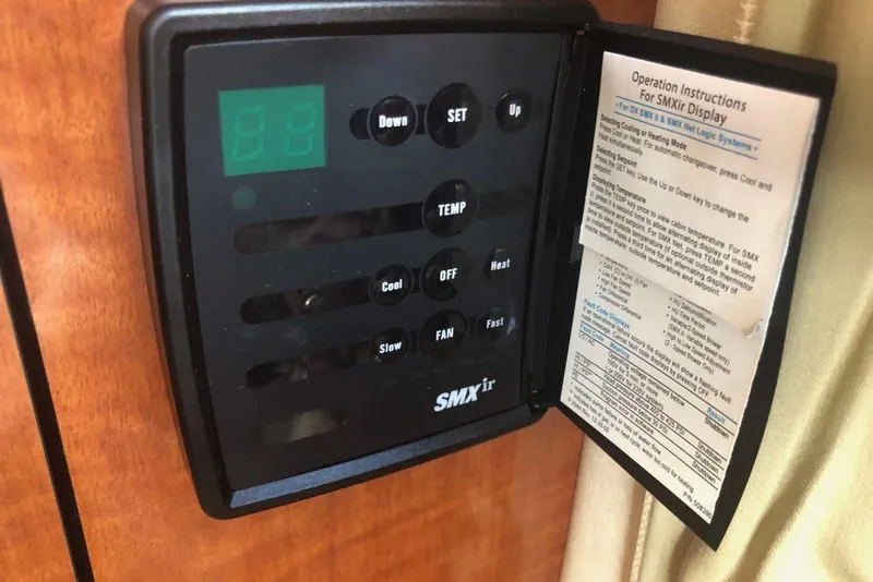 Slide: The Image of Digital control panel on a 2005 Sea Ray 280 Sundancer boat with operation instructions. - 51