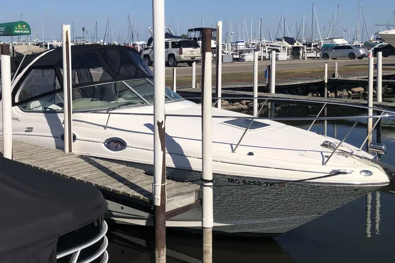 Slide: The Image of 2005 Sea Ray 280 Sundancer docked at marina with clear blue sky. - 6
