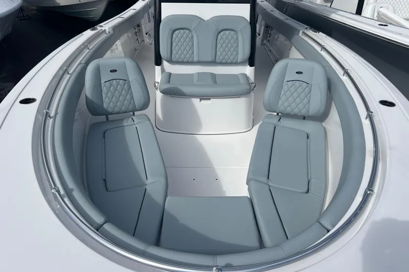 Slide: The Image of 2026 Sportsman Open 302 Center Console boat with luxurious seating arrangement. - 11