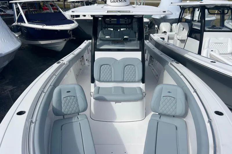 Slide: The Image of 2026 Sportsman Open 302 Center Console boat with sleek seating and modern design. - 12
