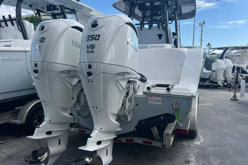 Slide: The Image of 2026 Sportsman Open 302 Center Console with twin Yamaha 350 V6 outboard engines. - 2