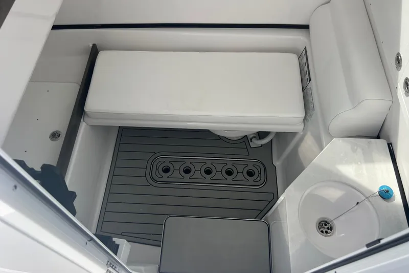 Slide: The Image of 2026 Sportsman Open 302 Center Console interior with seating and sink. - 20