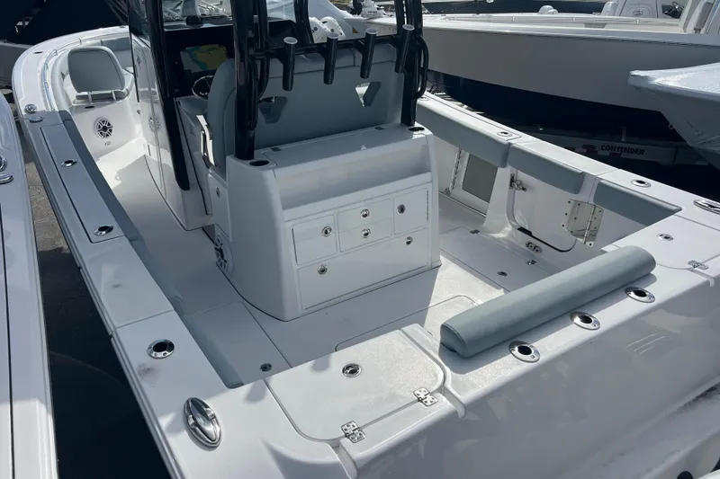 Slide: The Image of 2026 Sportsman Open 302 Center Console boat interior with seating and storage. - 3
