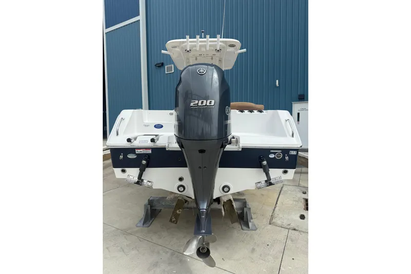 Slide: The Image of 2017 Sea Hunt Ultra 225 boat T-top with rod holders and speakers. - 10