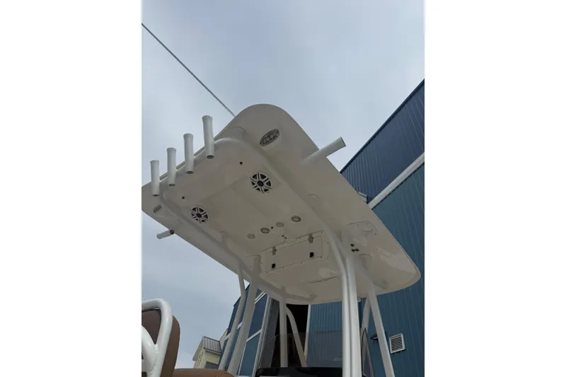 Slide: The Image of 2017 Sea Hunt Ultra 225 boat on trailer under clear blue sky. - 13