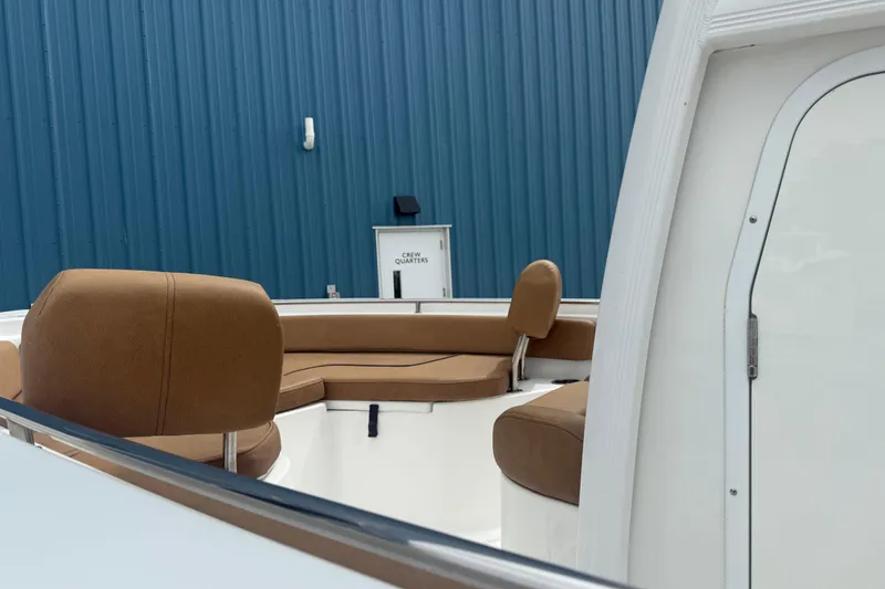 Slide: The Image of 2017 Sea Hunt Ultra 225 boat with Yamaha 200 engine, docked outdoors. - 7