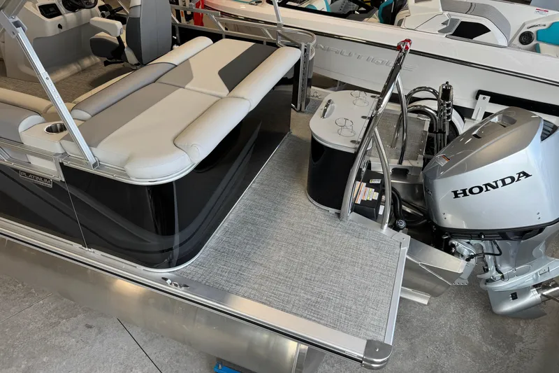 Slide: The Image of 2026 Avalon Venture 85 CR pontoon boat with Honda outboard motor, featuring sleek seating and modern design. - 10