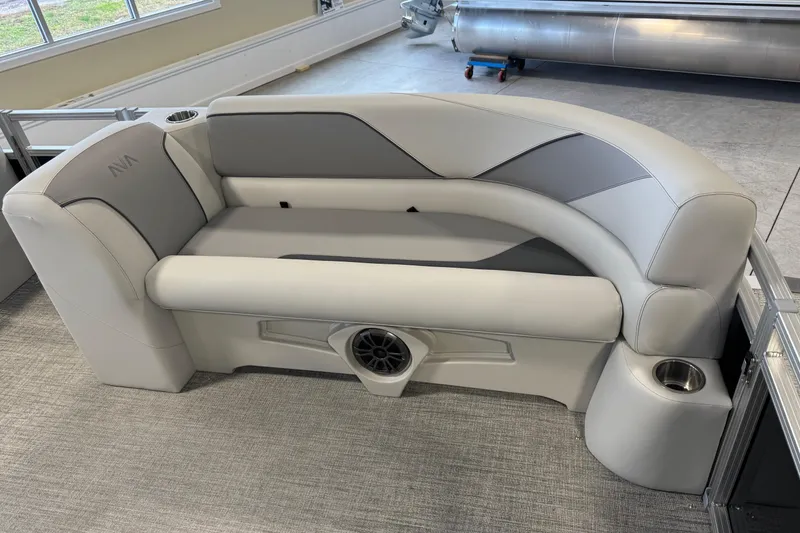 Slide: The Image of Luxurious seating in the 2026 Avalon Venture 85 CR boat, featuring cup holders and speaker. - 5