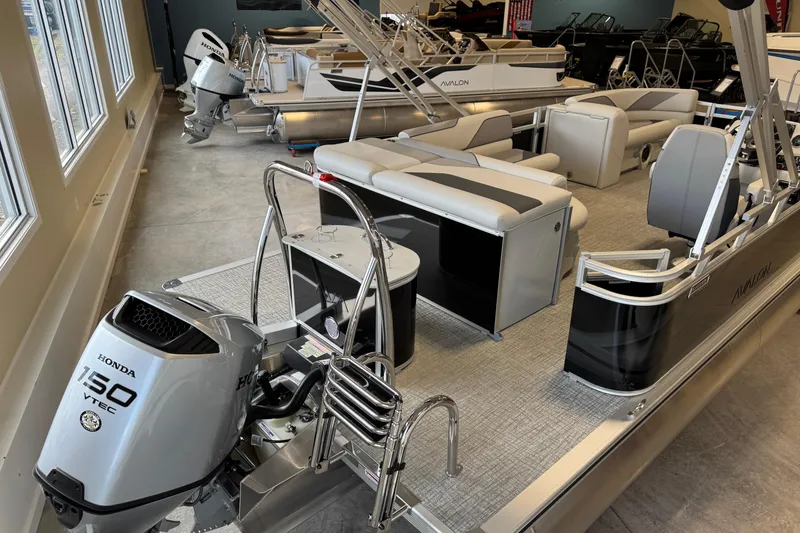 Slide: The Image of 2026 Avalon Venture 85 CR pontoon boat with Honda 150 VTEC engine in showroom. - 9