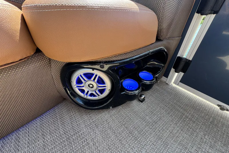 Slide: The Image of Speaker and illuminated cup holders in 2017 Regency 254 LE3 boat interior. - 8