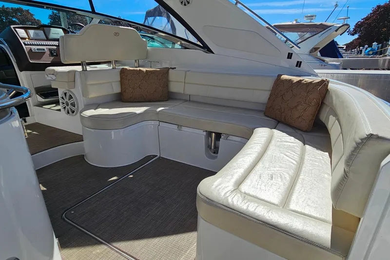 Slide: The Image of Luxurious seating area on a 2009 Cobalt 373 boat with plush cushions. - 10