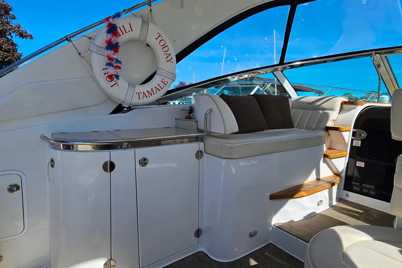 Slide: The Image of Interior of a 2009 Cobalt 373 yacht with seating and life preserver. - 11