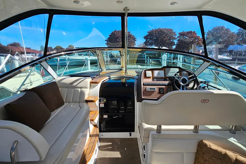 Slide: The Image of Interior view of a 2009 Cobalt 373 boat with luxurious seating and helm. - 15