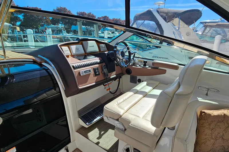 Slide: The Image of 2009 Cobalt 373 boat cockpit with leather seating and modern navigation controls. - 17