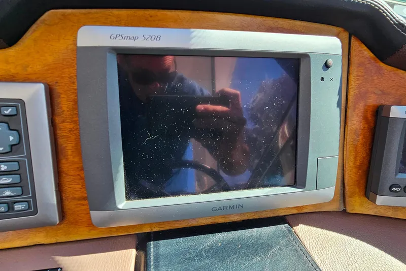 Slide: The Image of Garmin GPSmap 5208 on 2009 Cobalt 373 dashboard, reflecting sunlight. - 22