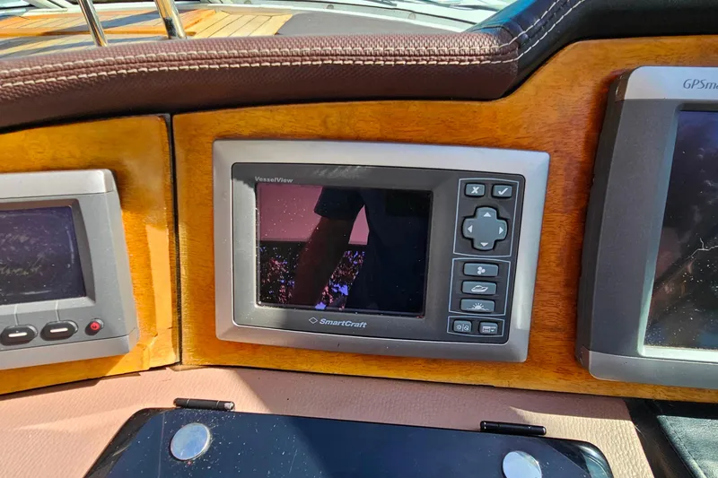 Slide: The Image of 2009 Cobalt 373 dashboard with SmartCraft VesselView display and controls. - 23