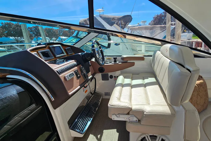 Slide: The Image of Interior of a 2009 Cobalt 373 boat with leather seating and modern dashboard. - 27