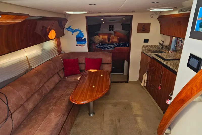 Slide: The Image of Luxurious 2009 Cobalt 373 yacht interior with plush seating and modern kitchenette. - 33