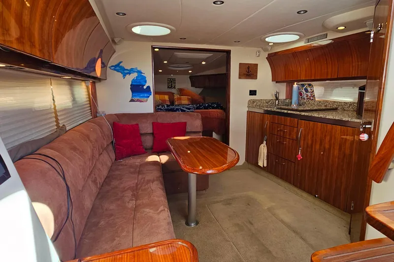 Slide: The Image of Interior of 2009 Cobalt 373 yacht with plush seating and modern kitchenette. - 34