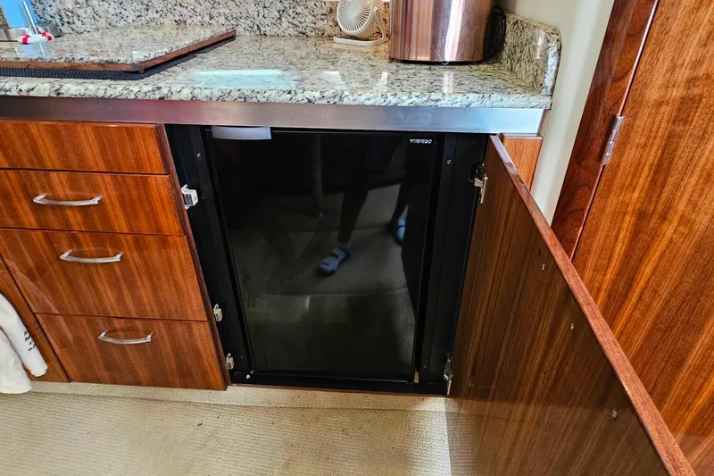 Slide: The Image of Luxury yacht interior with granite countertop and built-in fridge, Cobalt 373, 2009 model. - 37