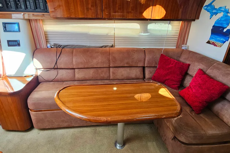 Slide: The Image of Luxurious 2009 Cobalt 373 yacht interior with plush seating and wooden table. - 38