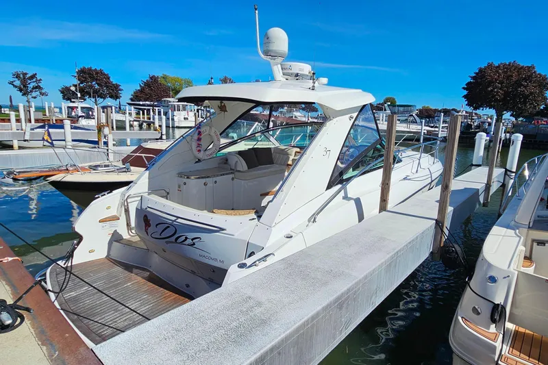 Slide: The Image of 2009 Cobalt 373 boat docked at marina under clear blue sky. - 4