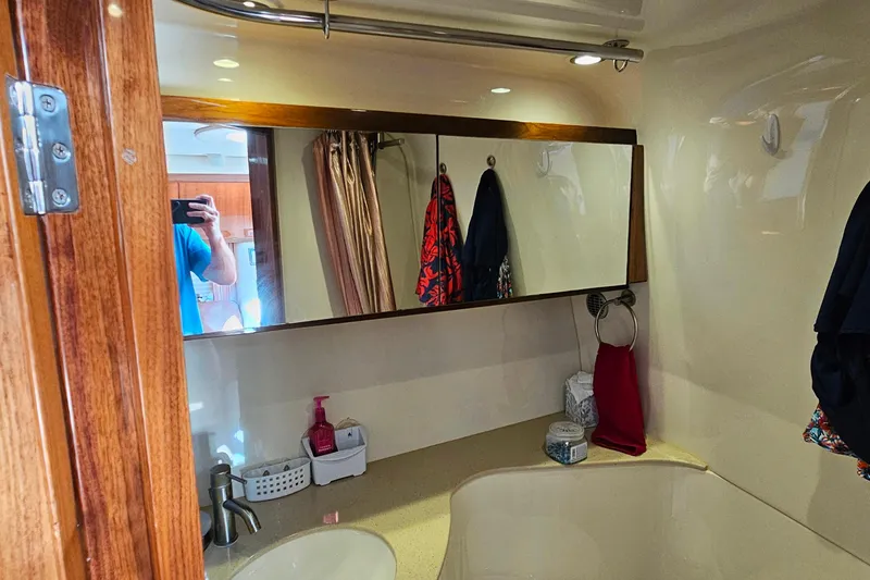 Slide: The Image of Bathroom interior of 2009 Cobalt 373 boat with mirror and sink. - 43